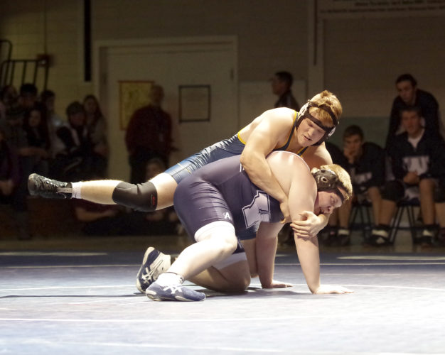 Times Observer photo by Ben Oviatt Ike's John Bortz and Warren's Matt Ristau go at it.